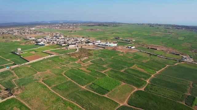 Aerial view of village between hills in Chakwal, Pakistan.