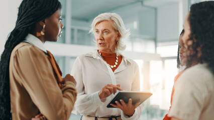 Meeting, tablet and update with business women in lobby of office for planning or strategy. Collaboration, discussion and reporting with employee team in workplace for agenda, feedback or review