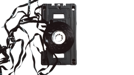 Tangled tape: exploring the nostalgia of an old audio cassette on transparent background