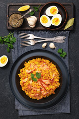 hot smoked salmon kedgeree in a black bowl