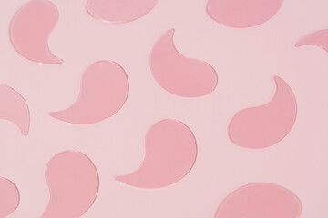 Pattern of pink hydrogel patches on pink isolated background. Concept of skin care under eyes, hydration and anti dark circles. Image for your design