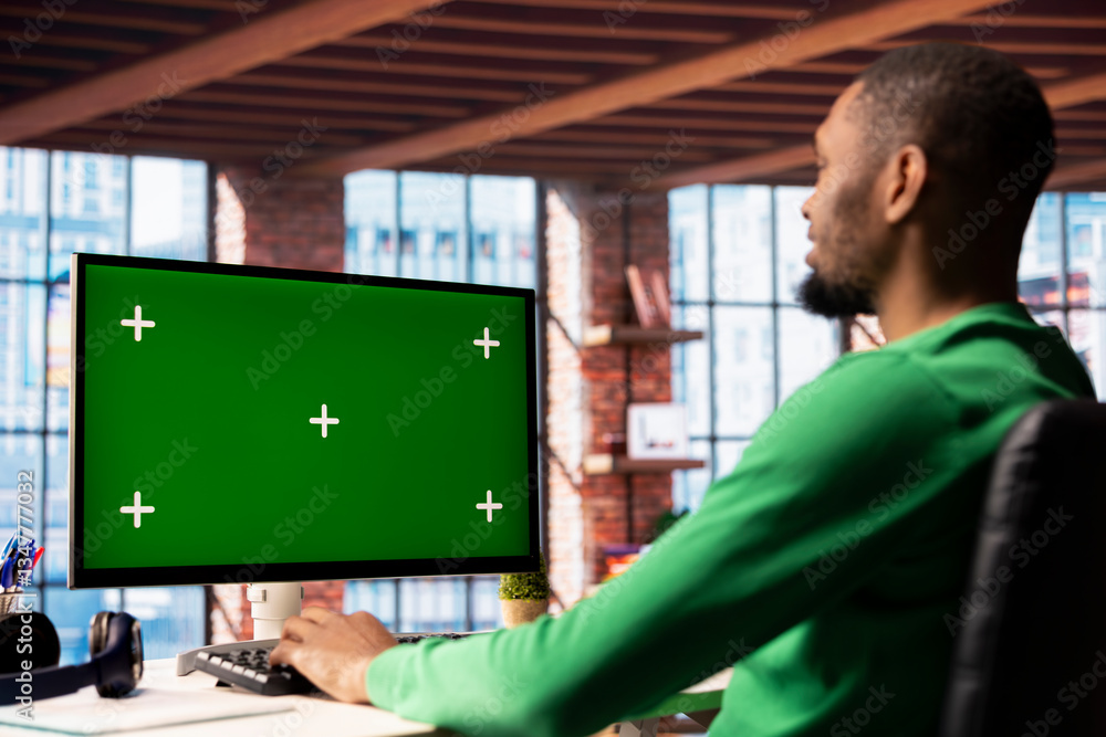 Poster man using isolated screen pc in home office to write emails. african american person typing on mocku