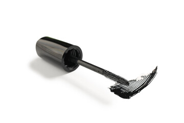 Black mascara brush with sample on white background