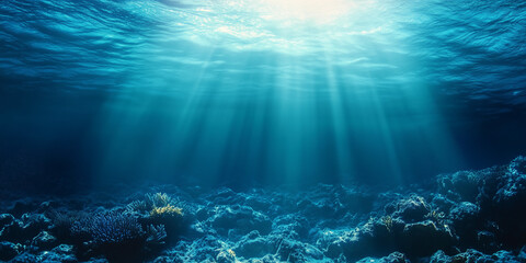 Naklejka premium Underwater view of sunlight rays penetrating the ocean depths