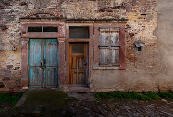 Three Unique Entryways in a Weathered Stone Building