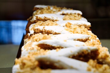 Freshly Sliced Carrot Cake with Cream Cheese Frosting and Walnuts