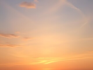 Obraz premium Beautiful Sunset Sky Orange, Yellow, and Blue Hues, Clouds and Light, Nature Background, Scenic, Peaceful, Aesthetic.