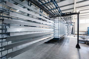 metal painting shop, parts ready for painting, perforated metal profiles
