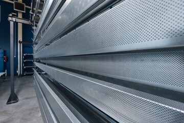 metal painting shop, parts ready for painting, perforated metal profiles