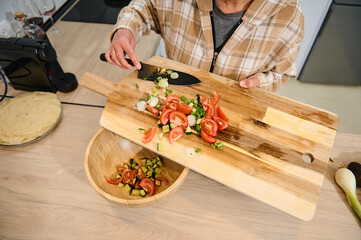 Preparing Fresh Vegetable Salad in a Cozy Home Kitchen