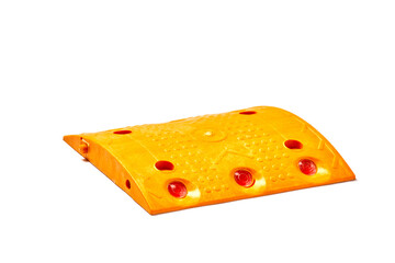 Bright Orange Rubber Speed Bump with Reflective Strips for Enhanced Safety and Visibility on Roadways and Parking Lots, Designed to Manage Vehicle Speed Effectively