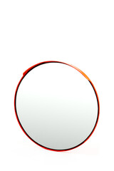 A Stylish Circular Mirror with a Vibrant Red Frame Exhibiting Modern Design and Clean Lines for Contemporary Home Decor and Interior Spaces