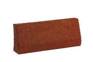 A Close-up Image of a Red Brick, Featuring a Rough Texture and Angular Shape, Perfect for Construction Applications and Artistic Displays in Architecture and Design Projects