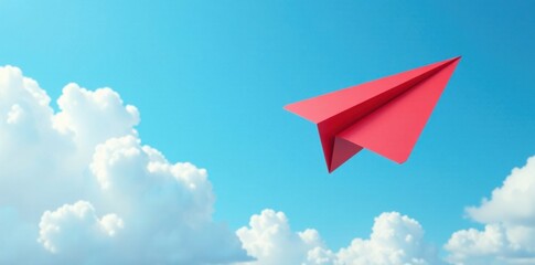Red paper plane glides in front of white clouds on blue sky, motivation symbol, aerial navigation