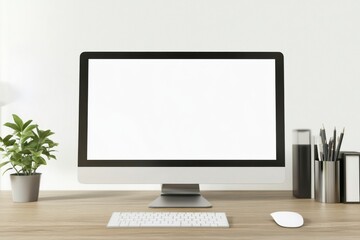 Fototapeta premium a computer with a blank white screen on a wooden desk in a modern office interior mock-up