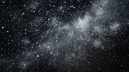 Obraz premium White fireworks against a black background, with white sparkles in the night sky