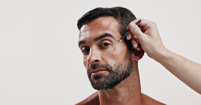 Hands, portrait and man with tweezer in studio for hair removal, maintenance and facial growth. Person, tools and grooming routine of eyebrow hygiene, self care and transformation on white background
