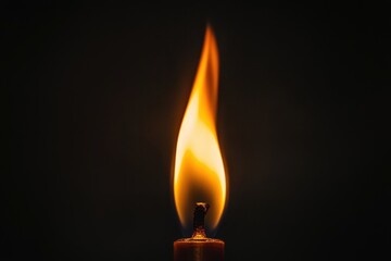 A close up image of a burning candle flame