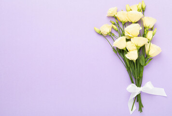 Beautiful bouquet with eustoma flowers on color background, top view