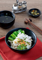 chinese egg noodle in bowl with slice red roasted pork, pork's wontons and white crab meat on it.