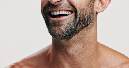 Happy, teeth and beard of man in studio for wellness, health and cosmetics for grooming. Dermatology, skincare and face closeup of person for hygiene, facial care and dental smile on white background
