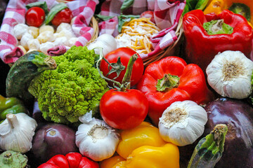 Pile of colourful raw organic vegetables in market outside