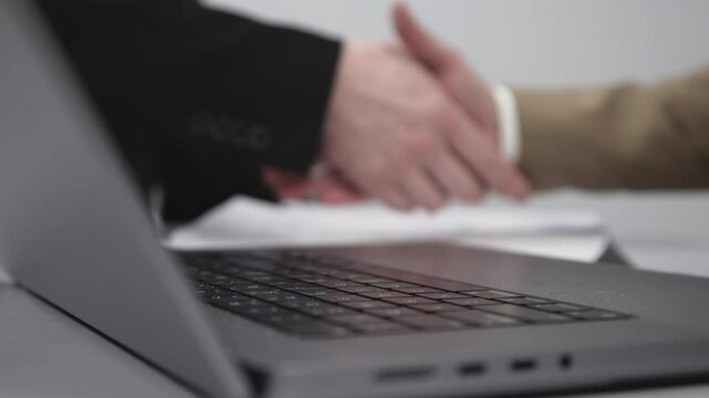 Businessmen signing documents, handling deals and contracts. Concept legal formalities, bank loans, insurance purchases, and will preparation in the office environment.