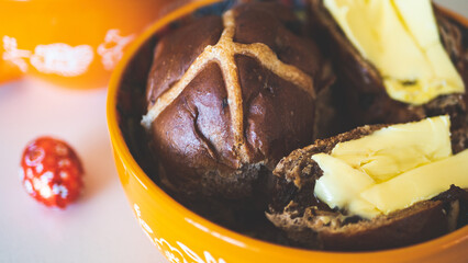 Hot cross buns with cup of tea easter holiday close up baking tasty delicious food 