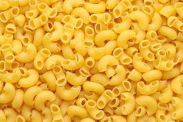 Raw horns pasta as background, top view