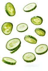 Fresh and Vibrant Cucumber Slices Falling Through Air Against White Background, Perfect for Healthy Food Themes and Culinary Use