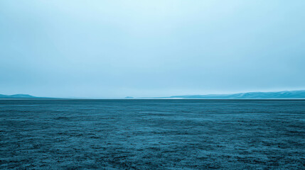 Obraz premium Tranquil Blue Landscape with Endless Horizon and Soft Overcast Sky in Calm Atmosphere