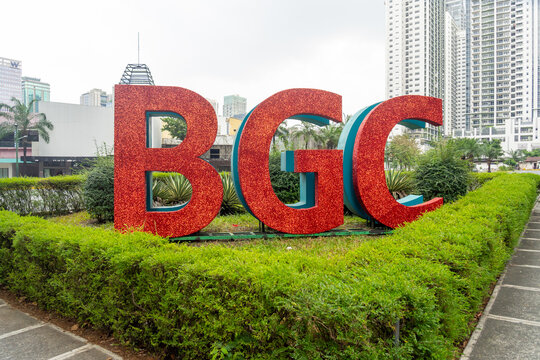 Taguig, Metro Manila, Philippines - February 13, 2025: Red sign of 
BGC or Bonifacio Global City seen in Taguig, Metro Manila, Philippines. 
Bonifacio Global City is a financial business district. 
