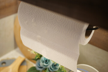 Kitchen counter with paper towel holder and decorations in focus