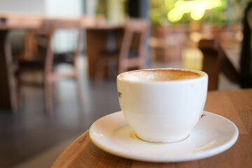 Enjoying coffee in a cozy cafe with warm ambiance