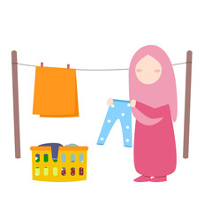 Muslim girl drying clothes 