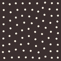 a black and white polka dot pattern with a white dot