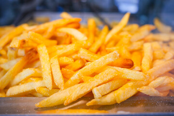 Crispy golden fries served in a fast food restaurant setting