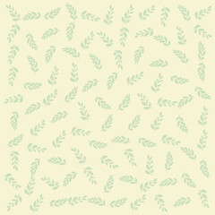 a pattern of leaves on a light yellow background