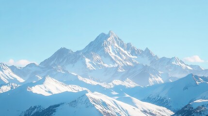 A majestic mountain range covered in snow, with a clear blue sky in the background.