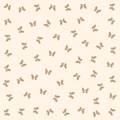 a pattern of small brown leaves on a beige background