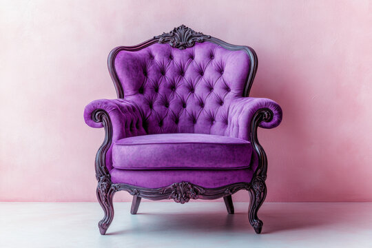Purple chair against pink wall, with a golden table and potted plant next to it. Sunlight casts shadow on the floor. A minimalistic and cozy corner.