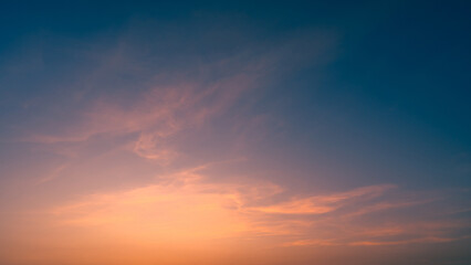 Dusk,Sunset sky twilight in the evening with Orange, pink and purple colorful sunlight majestic Summer sky Backgrounds.