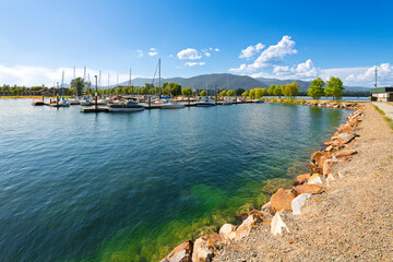 The marina in the downtown lakefront district of Sandpoint, Idaho, with boats filling the docks on...