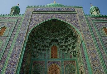 Intricate Islamic Architecture with Turquoise Mosaic Tiles and Arched Entrance