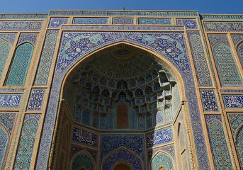 Ornate Mosque Architecture Featuring Intricate Tile Work and Grand Archway