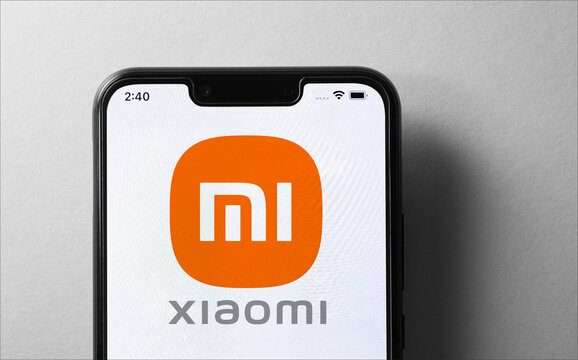 Close up of Xiaomi logo on screen of mobile phone.
