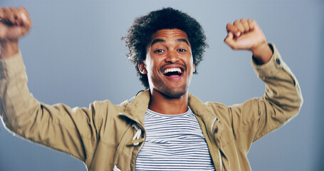 Dance, fist pump and portrait of happy man in studio for celebration, clubbing or party fun....