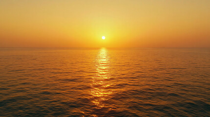 Obraz premium A serene sunset over calm waters, casting a warm golden hue across the horizon, reflecting tranquility and natural beauty.