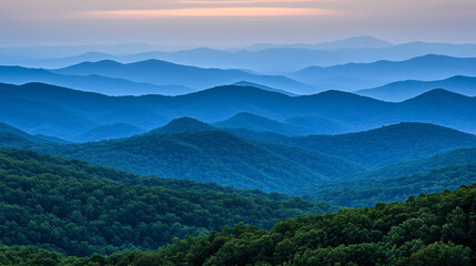 Fototapeta premium A serene landscape showcasing rolling mountains with varying shades of blue, creating a peaceful and tranquil atmosphere.
