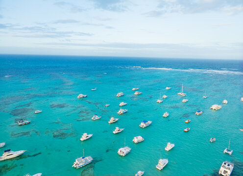A large body of water with many boats floating on it